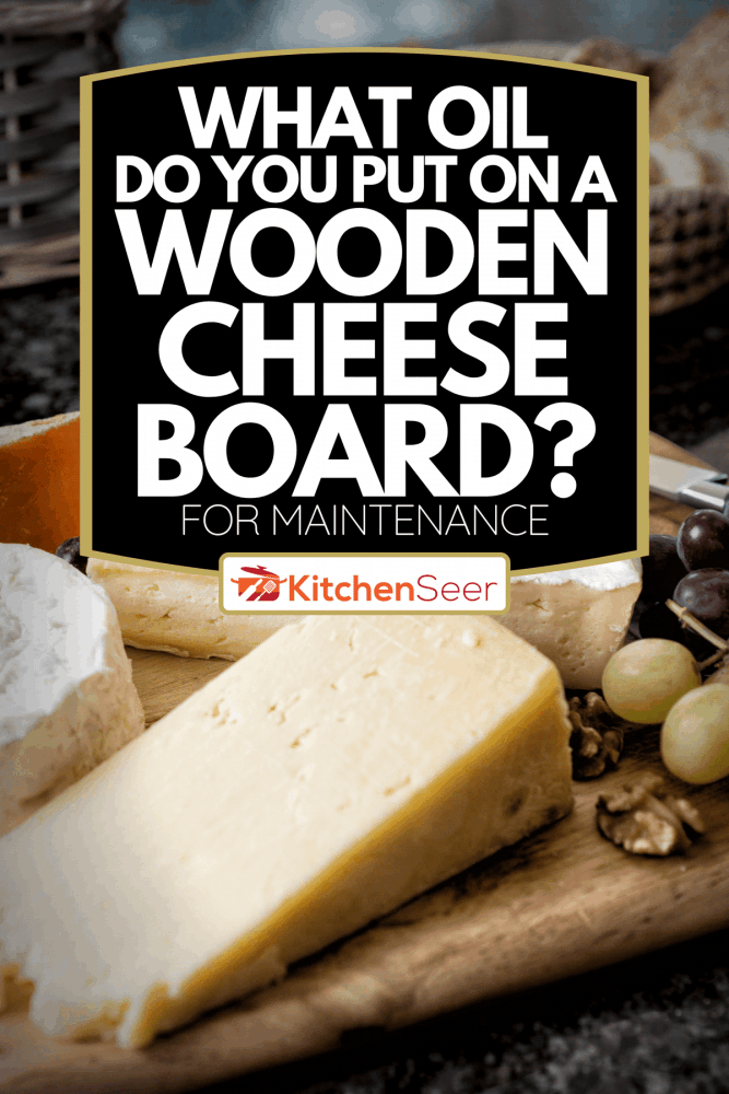 精选英式和法式奶酪在乡村板上，你在木头奶酪板上放什么油?(维护)