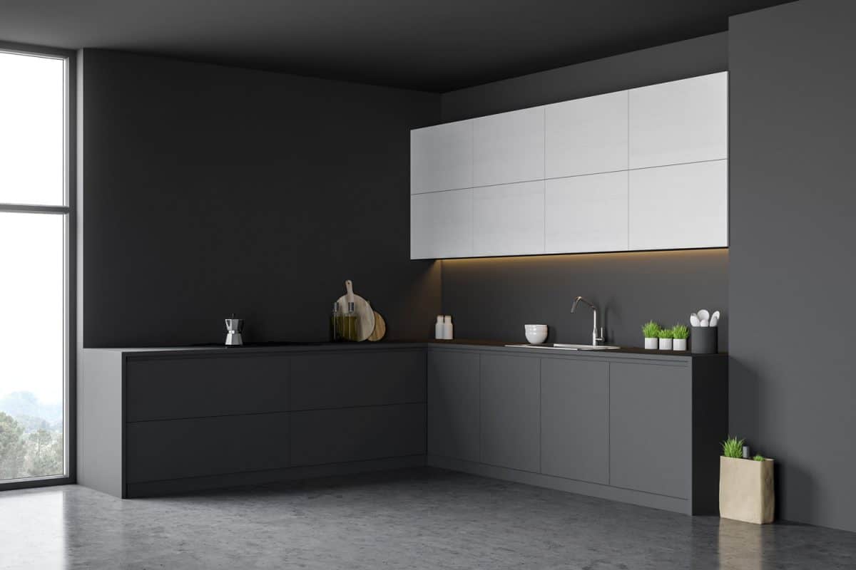 一个极简主义风格的小厨房，白色的浮动橱柜和黑色的下层橱柜bd手机下载