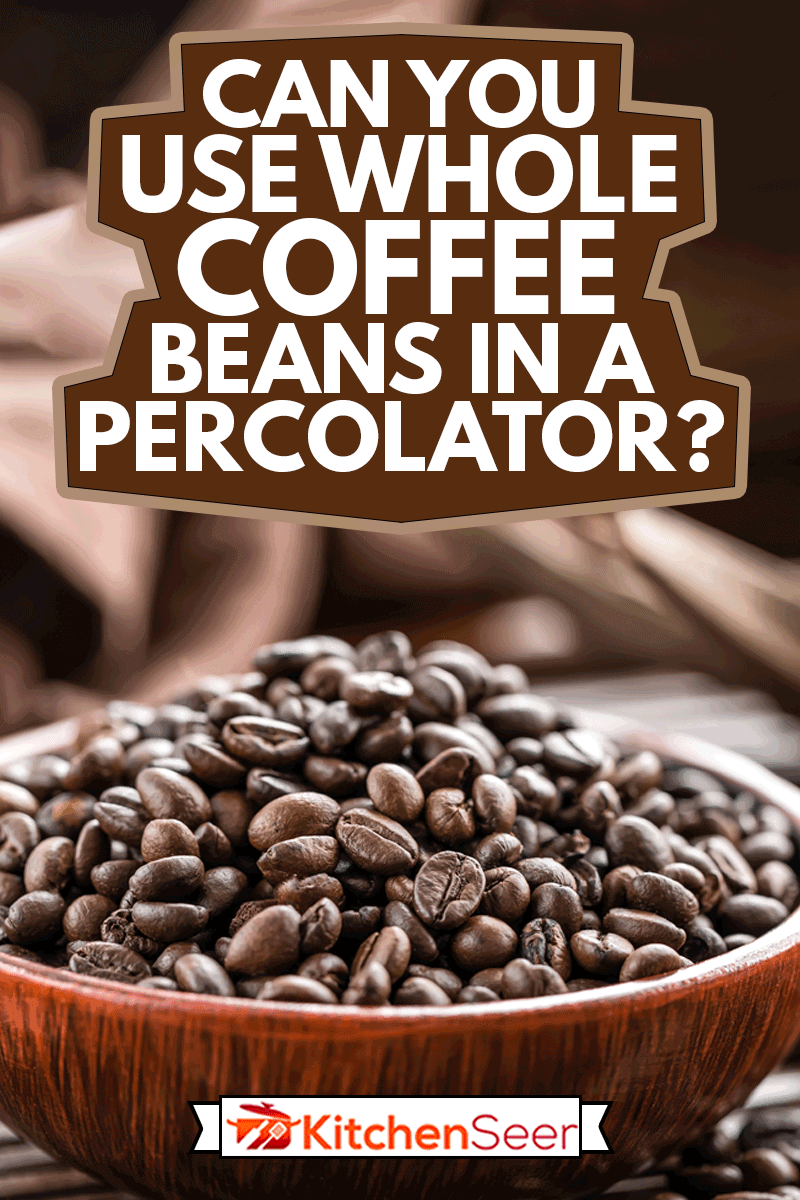 fo黑咖啡豆子在一个木制碗,你可以在过滤器中使用整个咖啡豆吗?