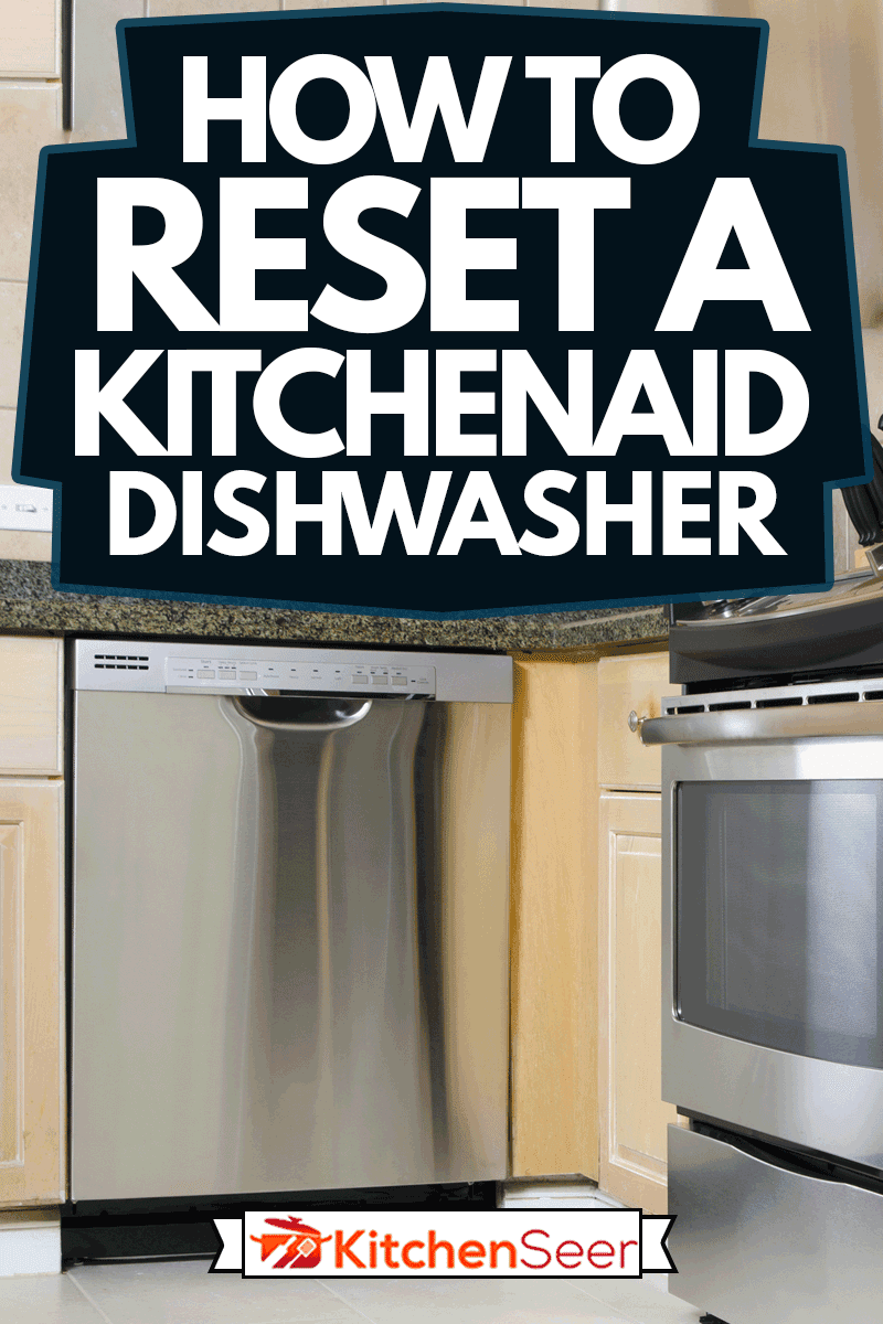 一个现代化的厨房，bd手机下载配有不锈钢电器，包括洗碗机，如何重置厨房和洗碗机