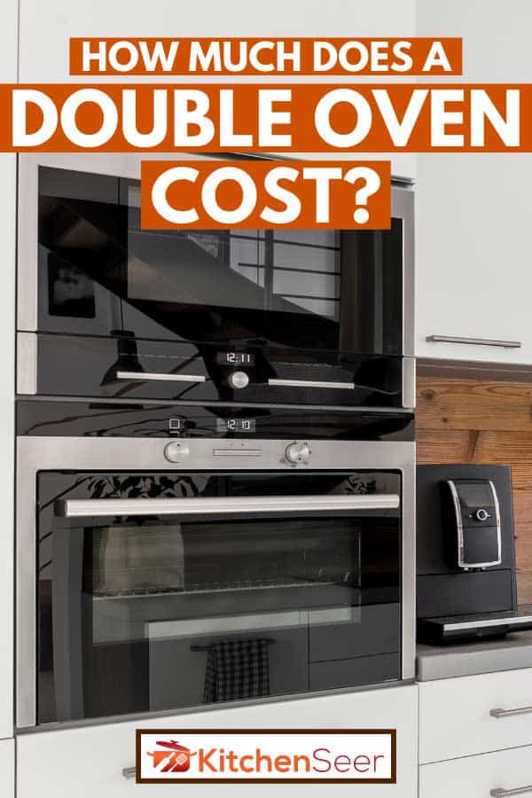 有双烤箱和白色bd手机下载橱柜的现代厨房，双烤箱要多少钱?
