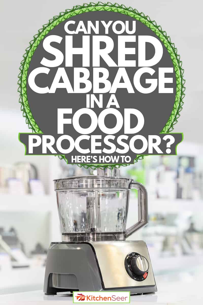 A food processor on a white themed kitchen with other kitchen appliances on the background, Can You Shred Cabbage In A Food Processor? [Here's How To]
