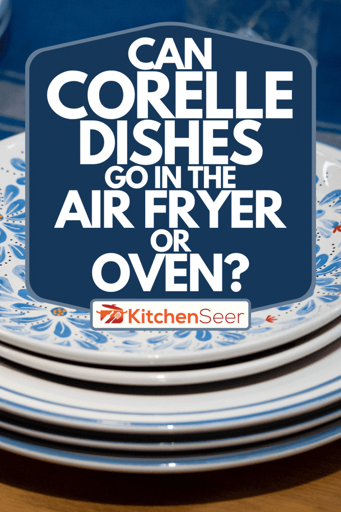 桌上一叠蓝色的带花的盘子，Corelle菜可以放在空气炸锅或烤箱里吗?