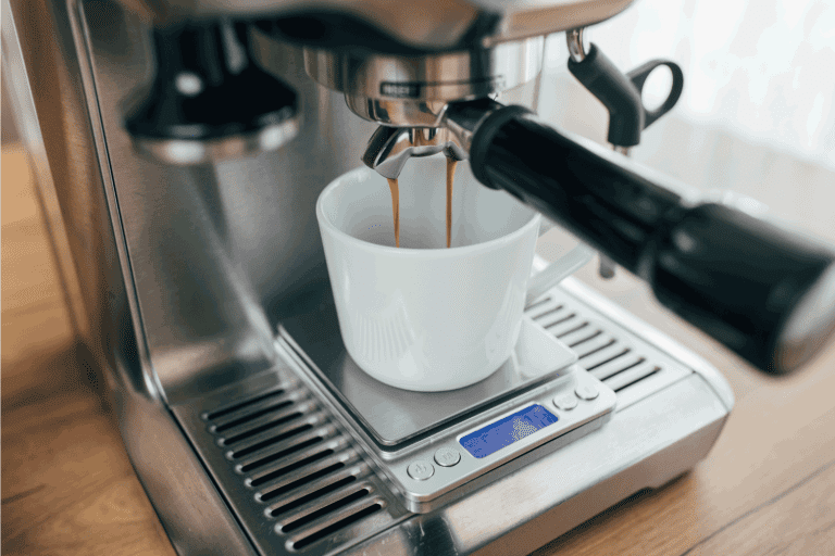 white-cup-on-a-small-scale-espresso-machine-dripping-with-coffee.-Can-An-Espresso-Machine-Explode