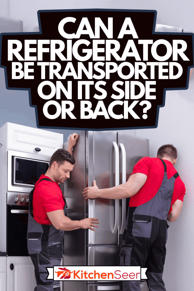 两个年轻的男性搬运工把钢制冰箱放在厨房里，冰箱可以侧着运还是向后运?bd手机下载