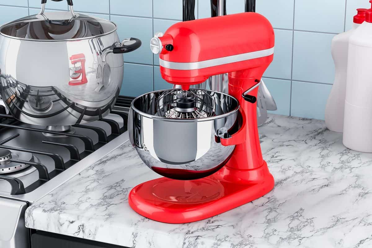 Red stand kitchen mixer on the kitchen table