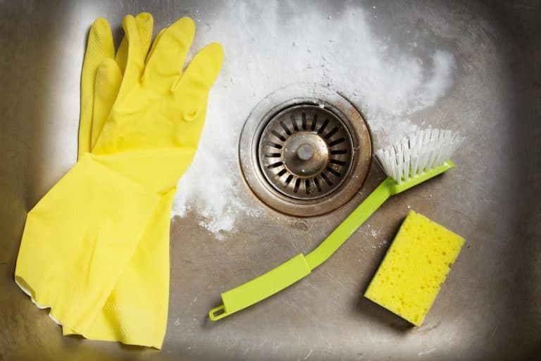 清洁产品和橡胶手套在一个肮脏的厨房水槽,如何清洁厨房水槽排水塞bd手机下载