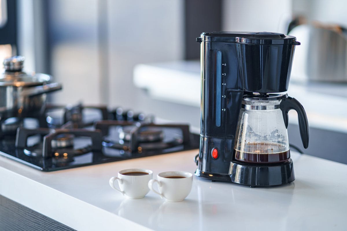 Coffee maker for making and brewing coffee at home